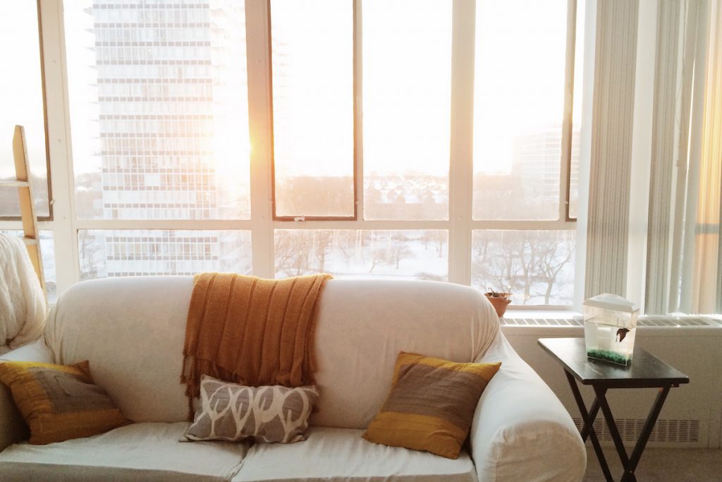 sunrise in a living room apartment with view of the city