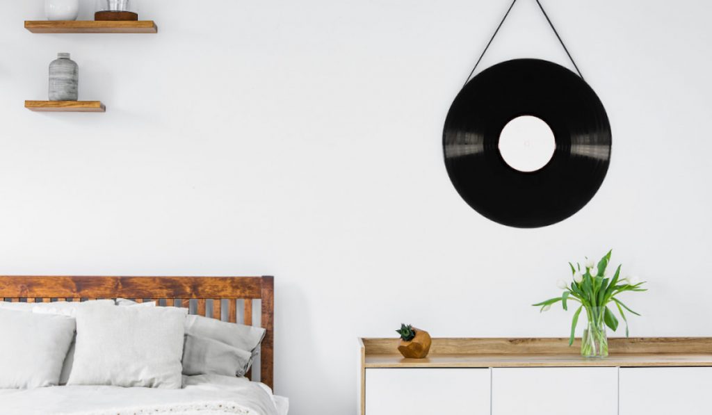 vinyl record mirror hanged on a white wall.